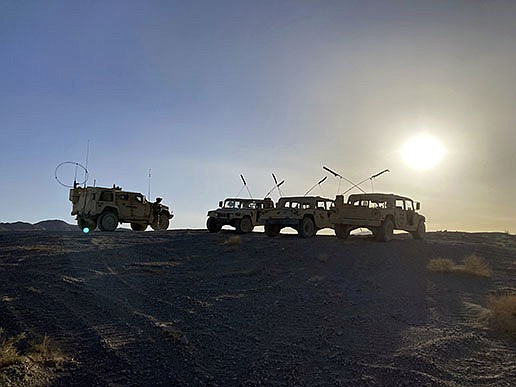 Army vehicles sit ready on a ridge early Tuesday as soldiers from the 2nd Brigade, 1st Cavalry Division, prepare for a mock attack on an enemy in the town nearby during a training exercise at the National Training Center at Fort Irwin, Calif.
(AP/Lolita C. Baldor)