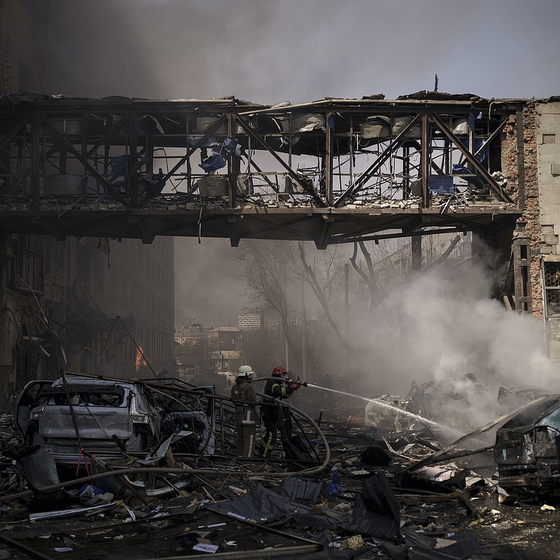 Firefighters work to extinguish multiple fires Saturday after a Russian attack in Kharkiv, Ukraine’s second-largest city. The Russian military has intensified its shelling of Kharkiv in recent days. More photos at arkansasonline.com/ukrainemonth2/.
(AP/Felipe Dana)