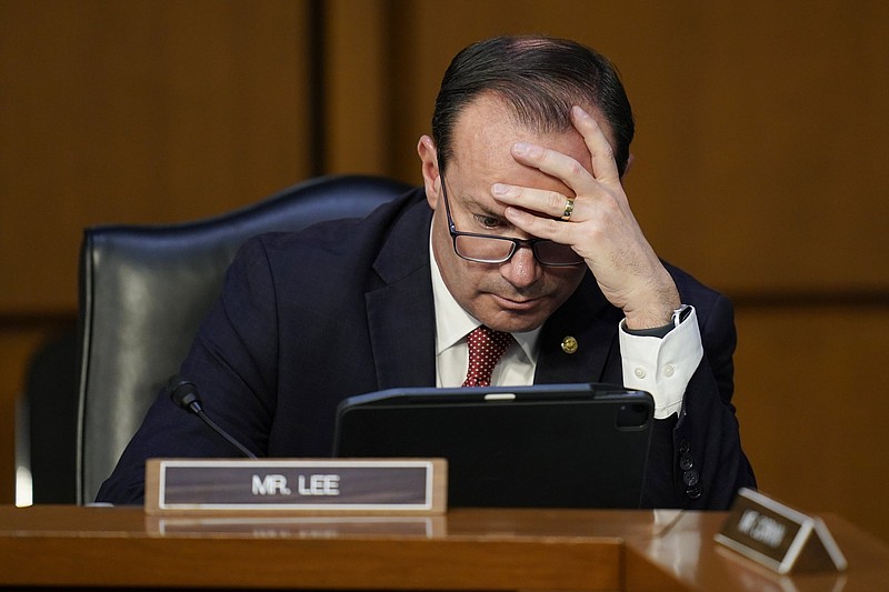 Sen. Mike Lee, R-Utah, looks at a tablet during Supreme Court nominee Judge Ketanji Brown Jackson’s confirmation hearing before the Senate Judiciary Committee on March 22 on Capitol Hill in Washington.
(AP/Carolyn Kaster)