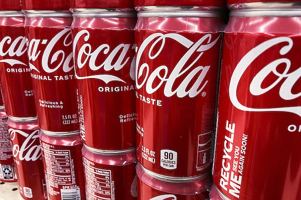 Cans of Coca-Cola are displayed in a grocery store Thursday, Feb. 10, 2022. (AP Photo/Nam Y. Huh)