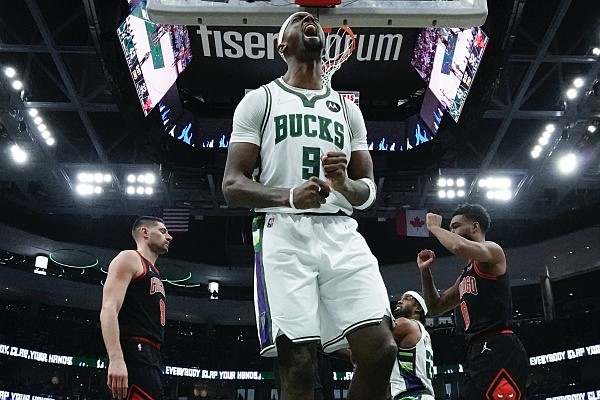 Milwaukee Bucks' Bobby Portis reacts after being fouled during the first half of Game 1 of their first round NBA playoff basketball game Sunday, April 17, 2022, in Milwaukee. (AP Photo/Morry Gash)