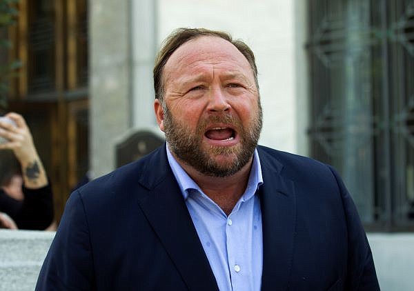 Alex Jones speaks to reporters in Washington, Sept. 5, 2018. Infowars filed for Chapter 11 bankruptcy protection on Sunday, April 17, 2022, in Texas as its founder and conspiracy theorist Alex Jones faces defamation lawsuits over his comments that the Sandy Hook Elementary School shooting was a hoax. (AP Photo/Jose Luis Magana, File)