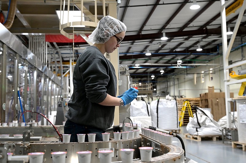 Nicole Garcia of Cabot monitors a machine making single-serve coffee pods at the Westrock Coffee factory in North Little Rock in this Jan. 30, 2020 file photo. (Arkansas Democrat-Gazette/Stephen Swofford)