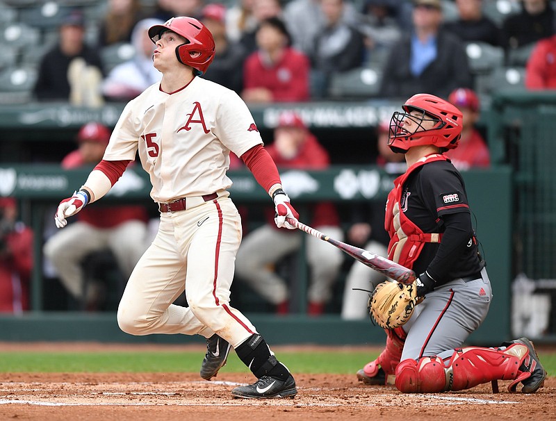 Arkansas catcher Dylan Leach hits a two-run home run in the third inning Wednesday against Arkansas State at Baum-Walker Stadium in Fayetteville. Leach went 2 for 4 with 3 RBI as the Razorbacks defeated the Red Wolves 10-3. More photos available at arkansasonline.com/421baseball/
(NWA Democrat-Gazette/Andy Shupe)