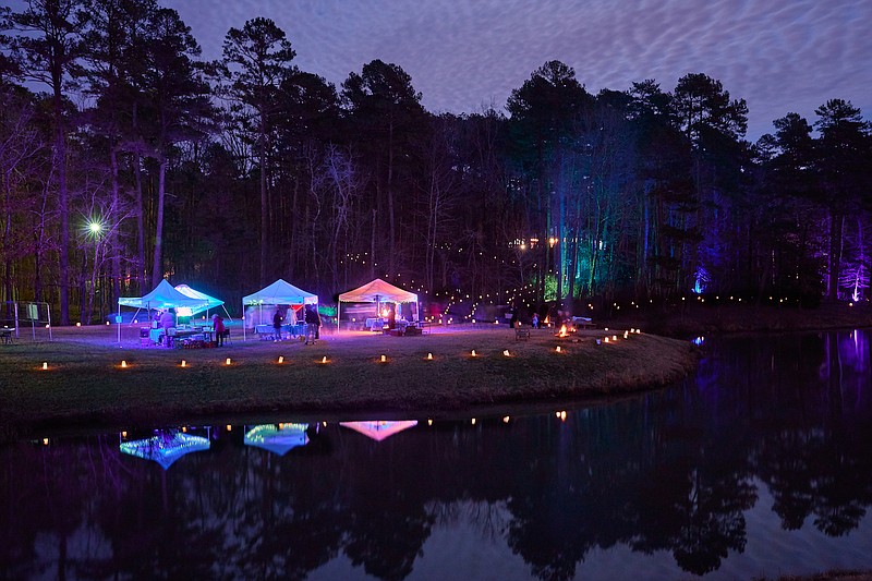 Hundreds of luminaria illuminate the grounds of Wildwood Park for the Arts in west Little Rock for "Lanterns." (Special to the Democrat-Gazette)