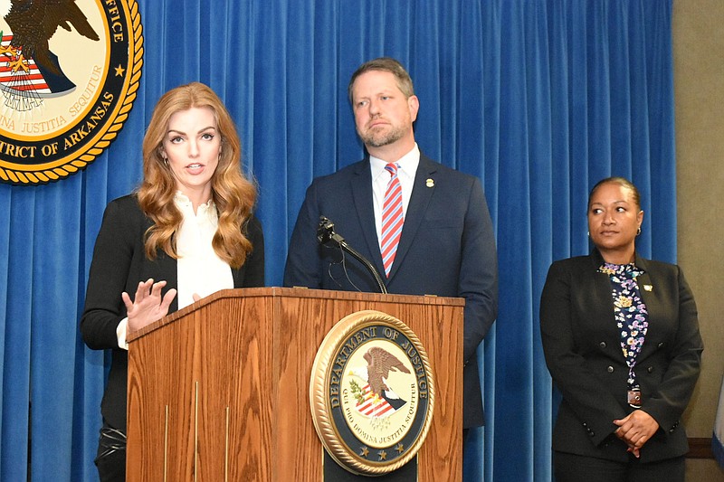 Allison Bragg (left), public information officer for U.S. Attorney Jonathan Ross (center) announces the sentence of an Oklahoma man who pleaded guilty to firearm trafficking as Pine Bluff Deputy Police Chief Denise Richardson looks on Wednesday, in Little Rock. 
(Pine Bluff Commercial/I.C. Murrell)