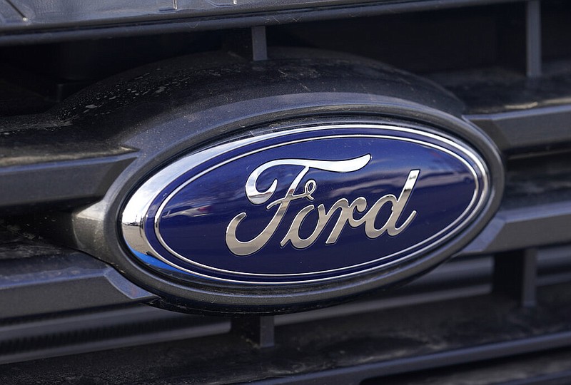 FILE - In this Sunday, April 25, 2021, photograph, the blue oval logo of Ford Motor Company is shown at a dealership in east Denver. Ford is recalling more than 650,000 pickup trucks and big SUVs in the U.S., Thursday, April 21, 2022, because the windshield wipers can break and fail. The recall covers certain F-150 pickups, and Ford Expedition and Lincoln Navigator SUVs from the 2020 and 2021 model years. (AP Photo/David Zalubowski, File)