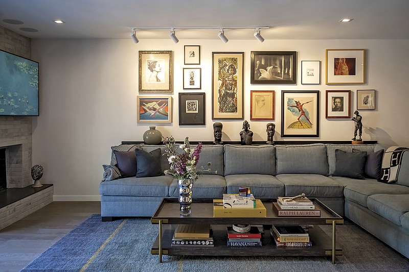 When Hollywood PR maven Howard Bragman downsized, he hired interior designer Christopher Grubb to help him pare down a vast art collection and repurpose key pieces into a curated gallery wall. (Courtesy of Arch-Interiors Design Group, Inc.)