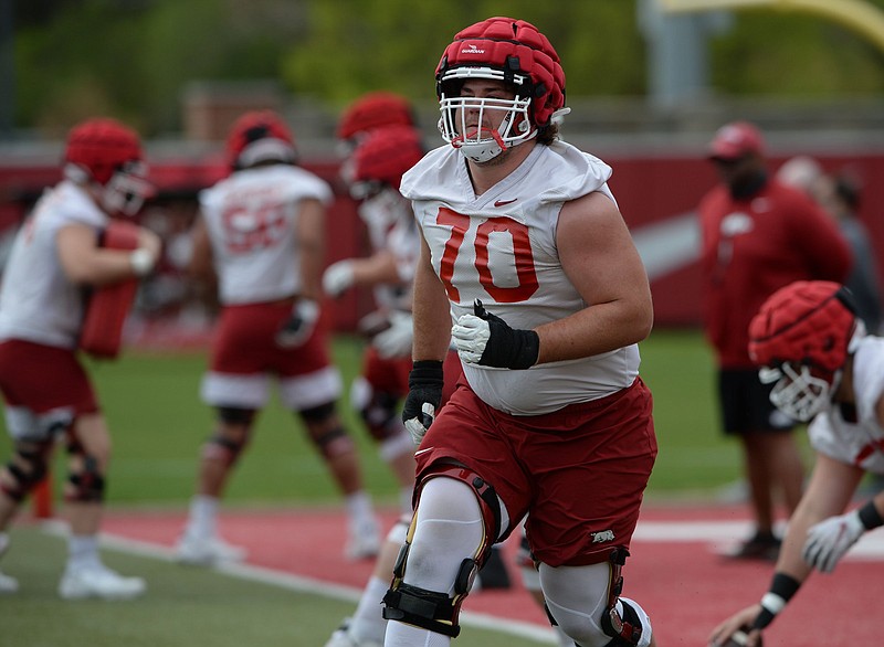Arkansas offensive lineman Luke Jones (70) takes part in a drill Thursday, April 15. 2021, during practice at the university practice field in Fayetteville. Visit nwaonline.com/210416Daily/ for today's photo gallery. .(NWA Democrat-Gazette/Andy Shupe)