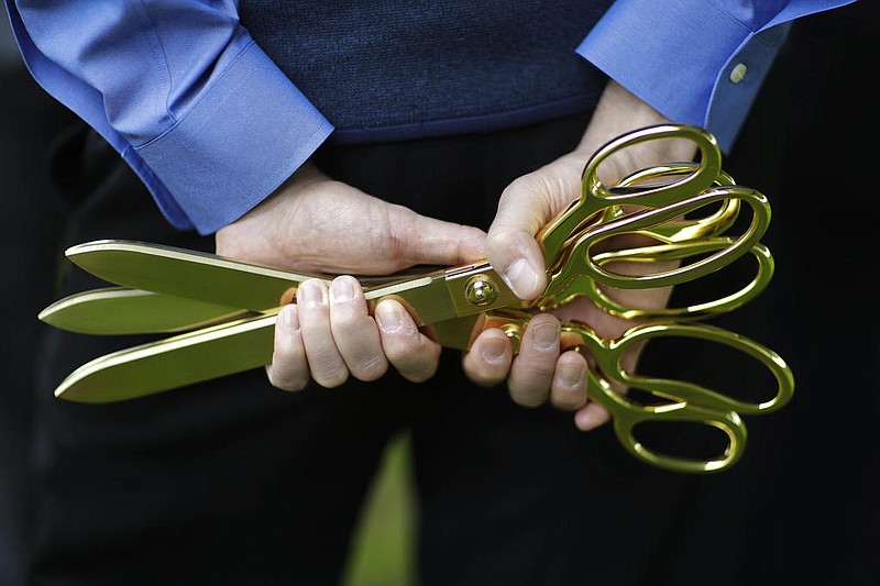 Scissors for a ribbon-cutting ceremony are shown in this Feb. 8, 2017 file photo. (AP/David Goldman)