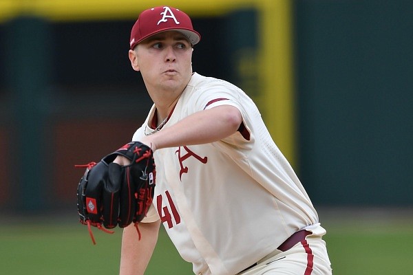 Arkansas starter Will McEntire winds up to throw a pitch Wednesday, April 20, 2022, during the first inning against Arkansas State at Baum-Walker Stadium in Fayetteville. Visit nwaonline.com/220421Daily/ for the photo gallery.