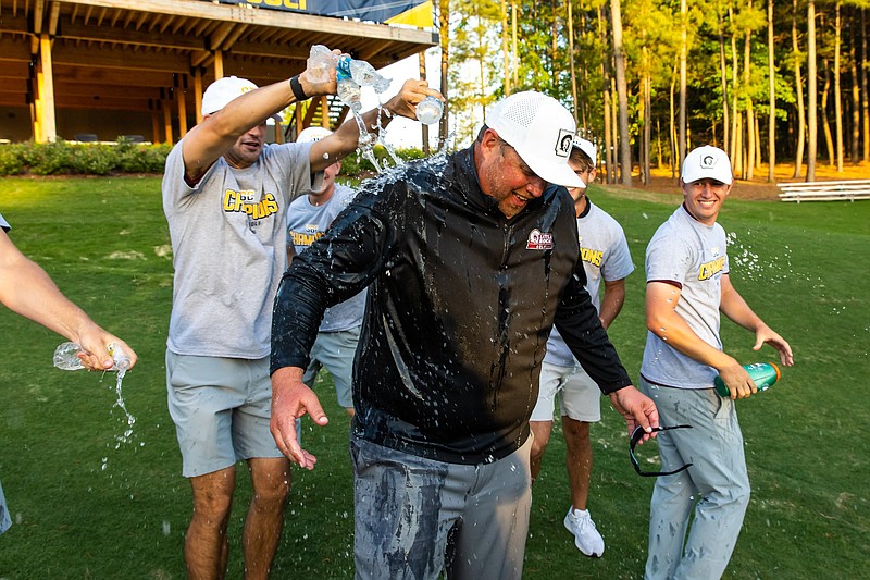 FILE — UALR men’s golf Coach Jake Harrington is splashed with water after the Trojans won the Sun Belt Conference men’s golf championship Wednesday at Mystic Creek Golf Club in El Dorado.
(Photo courtesy Sun Belt Conference)