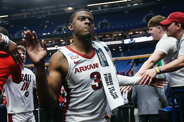 Arkansas forward Trey Wade greets fans, Thursday, March 17, 2022, at the end of their win in the first round of the 2022 NCAA Tournament at KeyBank Center in Buffalo, N.Y.