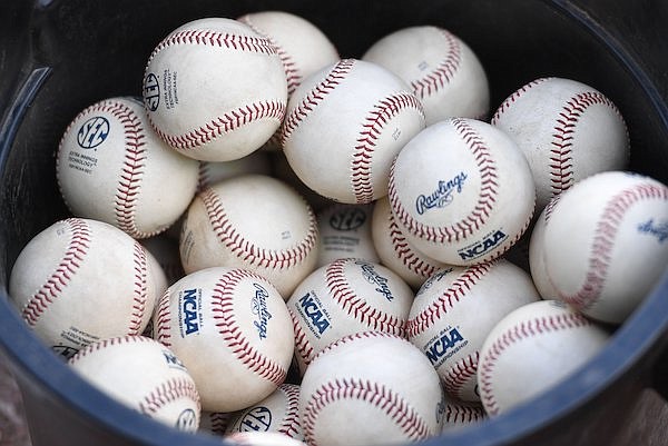 A bucket of baseballs are shown Friday, April 29, 2022, prior to an Arkansas game against Ole Miss at Baum-Walker Stadium in Fayetteville.