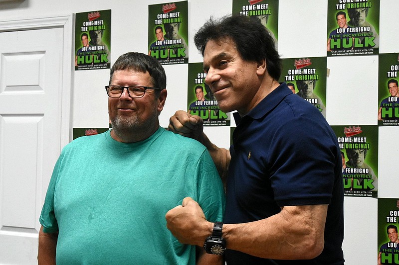 Lou Ferrigno (right), who played the original television title character The Incredible Hulk, stands next to Allen Taylor of Warren on Saturday at Double Header comic book and video game store in Pine Bluff. 
(Pine Bluff Commercial/I.C. Murrell)