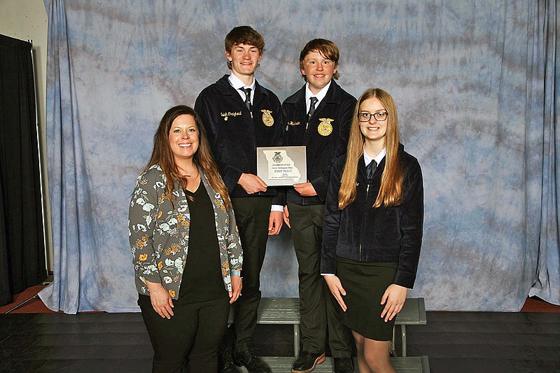 North Callaway FFA advisor Katie Robnett, from left, and students Isiah Craighead, Tyler Huddlestone and Lauren Riecke, pose with their first-place plaque after winning in floriculture at the 94th Missouri FFA Convention. (Submitted)