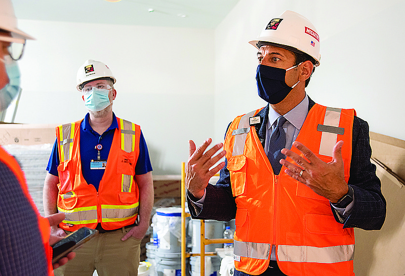 Gaspare Calvaruso, right, president of Capital Region Medical Center, talks about the need for the new outpatient surgery center currently under construction at the Madison Street campus. (Julie Smith/News Tribune photo)