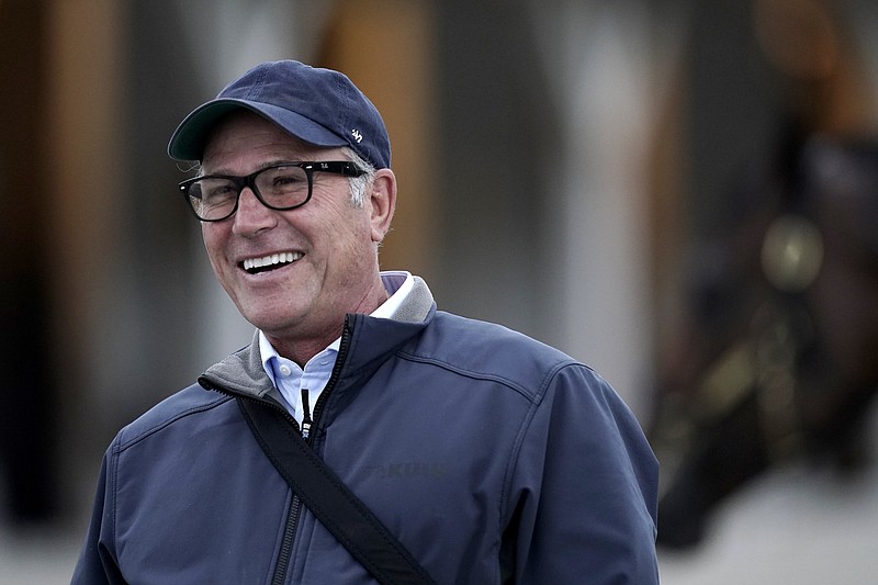 Trainer Tim Yakteen talks to visitors outside his barn at Churchill Downs Wednesday, May 4, 2022, in Louisville, Ky. The 148th running of the Kentucky Derby is scheduled for Saturday, May 7. 
(AP Photo/Charlie Riedel)