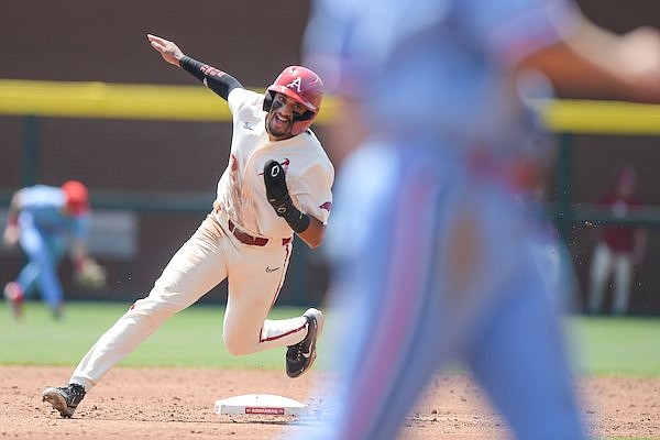 Arkansas shortstop Jalen Battles rounds second base during a game against Ole Miss on Sunday, May 1, 2022, in Fayetteville.