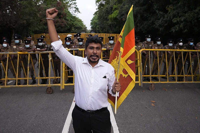 A man shouts slogans against the government Thursday outside the parliament in Colombo, Sri Lanka.
(AP/Eranga Jayawardena)