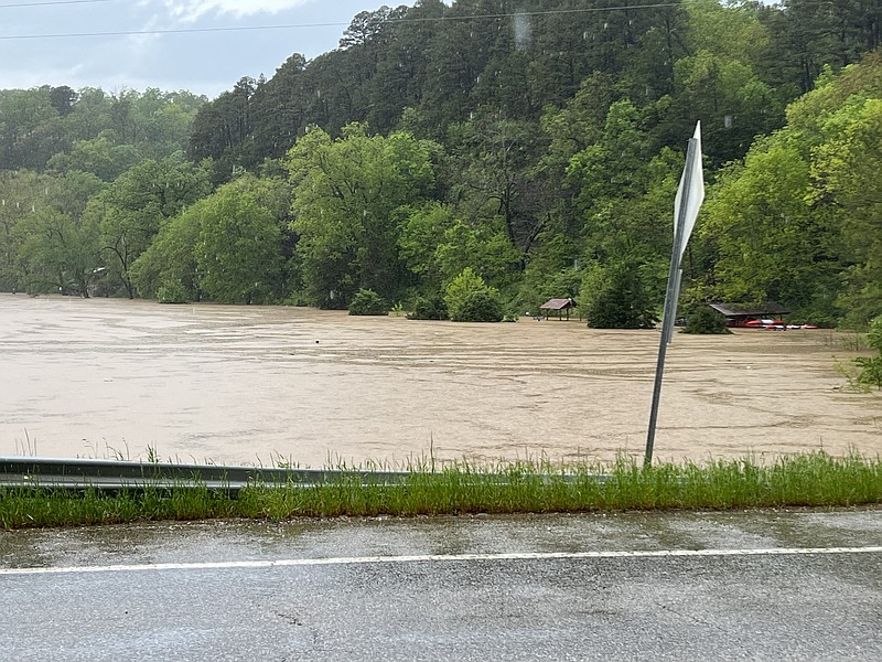 The Illinois River floods the Gypsie Camp and Canoe Thursday, May 5, 2022 off South Highway 59 is Siloam Springs.