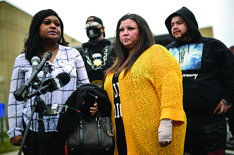 Katie Wright (center) stands beside activist Toshira Garraway and her son, Damik Bryant, during a news conference Thursday outside the police station in Brooklyn Center, Minn.
(AP/Star Tribune/Aaron Lavinsky)