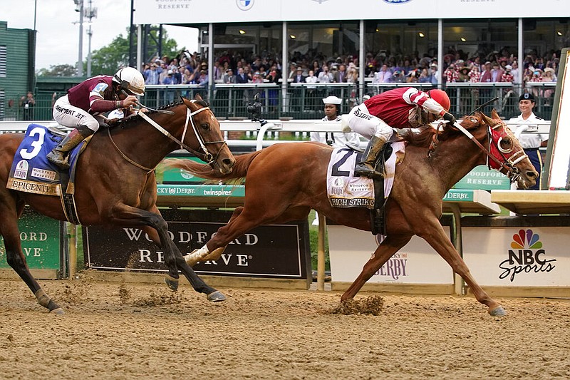 Rich Strike (21), with Sonny Leon aboard, beats Epicenter (3), with Joel Rosario aboard, at the finish line to win the 148th running of the Kentucky Derby at Churchill Downs on Saturday, May 7, 2022, in Louisville, Ky. (AP/Mark Humphrey)