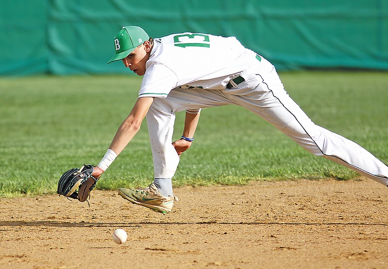 Blair Oaks shortstop Chase Schnieders reaches for a ground ball during Friday’s game against Centralia at the Falcon Athletic Complex in Wardsville. (Greg Jackson/News Tribune)