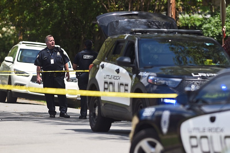 The Little Rock Police Department investigates the scene of a homicide near the intersection of F and North Harrison streets in this April 23, 2022 file photo. (Arkansas Democrat-Gazette/Staci Vandagriff)
