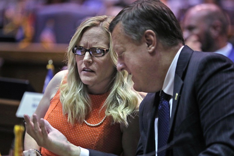 Indiana state Sen. Erin Houchin, R-Salem (left) speaks with Sen. Eric Koch, R-Bedford, during a legislative hearing at the Indiana Statehouse in Indianapolis on Aug. 21, 2021. Houchin benefitted from a Super PAC financed by a cryptocurrency CEO, getting several ads that helped boost her campaign leading up to the state’s Republican primary.
(AP/The Indianapolis Star/Kelly Wilkinson)