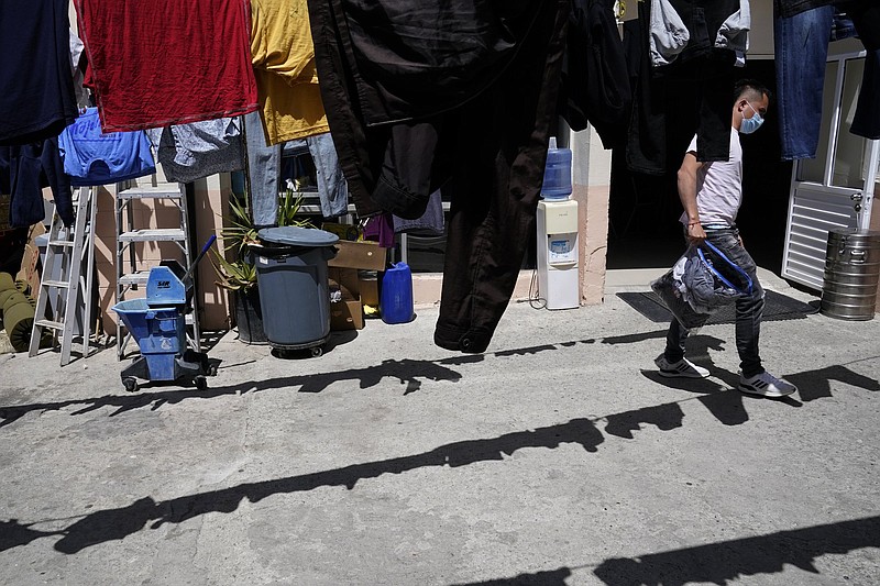 Juan, of Colombia, hangs his laundry to dry at a shelter for migrants on April 21 in Tijuana, Mexico.
(AP/Gregory Bull)