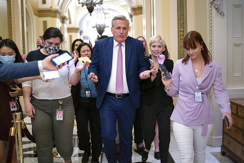 House Minority Leader Kevin McCarthy, R-Calif., heads to his office at the Capitol in Washington surrounded by reporters after House investigators Thursday issued a subpoena to McCarthy as part of their probe into the violent Jan. 6, 2021, insurrection. (AP/J. Scott Applewhite)