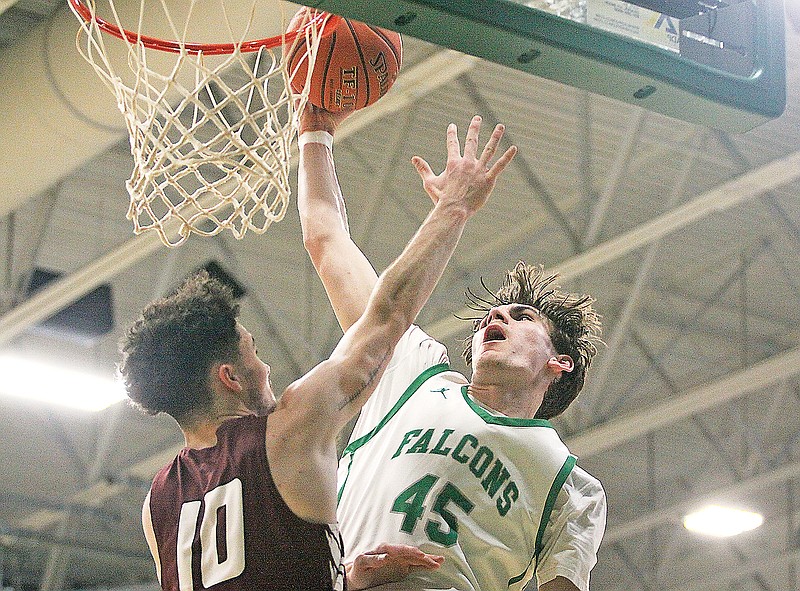 Luke Northweather of Blair Oaks goes up for a dunk against School of the Osage’s Brockton McLaughlin during a game this season in Wardsville. (Greg Jackson/News Tribune)