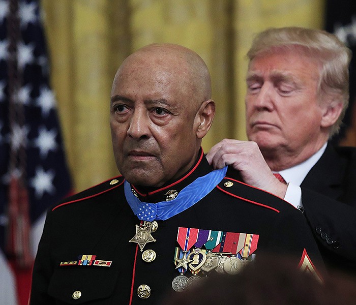 Then-President Donald Trump presents the Medal of Honor to retired U.S. Marine Corps Sgt. Maj. John Canley in October 2018 during an East Room ceremony at the White House. Canley, who was born in Caledonia and grew up in El Dorado, died Wednesday.
(AP/Manuel Balce Ceneta)