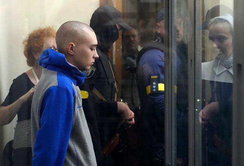 Russian army Sergeant Vadim Shishimarin, 21, is seen behind a glass during a court hearing in Kyiv, Ukraine on Friday. The trial of a Russian soldier accused of killing a Ukrainian civilian opened Friday.
(AP/Efrem Lukatsky)