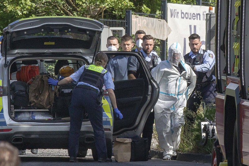 Police officers detain a suspect in Friday’s attack on a passenger train in Herzogenrath, Germany.
(AP/dpa/Ralf Roeger)