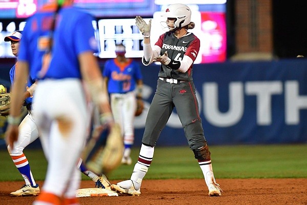 Arkansas' Danielle Gibson celebrates after reaching second base during the Razorbacks' game against Florida at the SEC softball tournament in Gainesville, Fla., on May 13, 2022.
