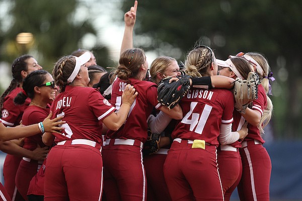 Arkansas softball players celebrate after the final out of the championship game of the SEC Tournament on Saturday, May 14, 2022, in Gainesville, Fla. (Leslie White, via SEC Media Portal)