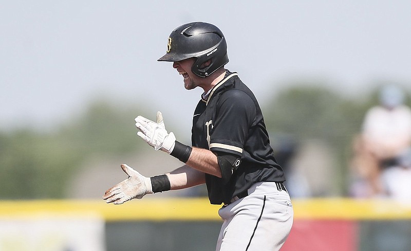 Bentonville third baseman Ethan Arnold celebrates after hitting an RBI double in the fifth inning Saturday against Springdale Har-Ber in the Class 6A state baseball semifinals at Springdale. More photos are available at arkansasonline.com/515boys6a/
(NWA Democrat-Gazette/Charlie Kaijo)