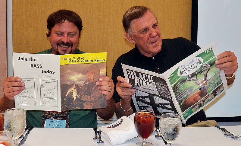 Brandon Butler sits with Ray Scott at a Southeastern Outdoor Media Association conference. (Contributed photo)