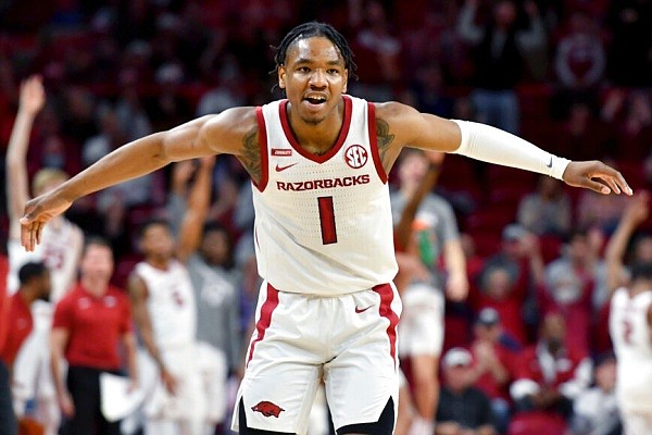 Arkansas guard JD Notae (1) reacts after hitting a 3-point shot against Elon during the first half of an NCAA college basketball game in Fayetteville on Tuesday, Dec. 21, 2021. (AP/Michael Woods)