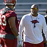 Arkansas defensive line coach Deke Adams directs his players Tuesday, March 15, 2022, during practice at Razorback Stadium in Fayetteville. Visit nwaonline.com/220316Daily/ for the photo gallery.