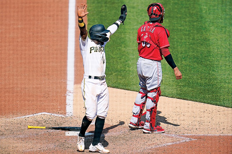 Rodolfo Castro of the Pirates celebrates after scoring the lone run of the game Sunday against the Reds in Pittsburgh. (Associated Press)