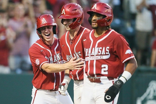 Arkansas Cayden Wallace (7), outfielder Jace Bohrofen (8) and nfielder Jalen Battles (2) react following a score, Saturday, May 14, 2022 during the fourth inning of a baseball game at Baum-Walker Stadium in Fayetteville. Check out nwaonline.com/220515Daily/ and nwadg.com/photos for a photo gallery.
