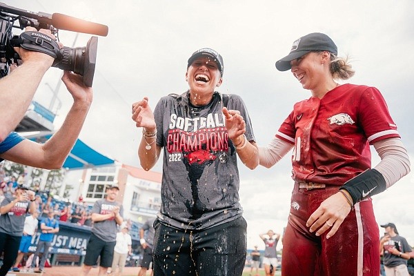 Arkansas softball coach Courtney Deifel reacts while celebrating the Razorbacks' win in the SEC softball tournament championship game on May 14, 2022, in Gainesville, Fla. Arkansas softball coach Courtney Deifel reacts while celebrating the Razorbacks' win in the SEC softball tournament championship game on May 14, 2022, in Gainesville, Fla.