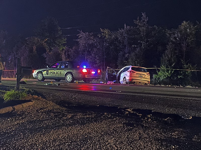 This photo provided by The Indiana State Police, police investigate a shooting late Monday, May 16, 2022 near Palmyra, Ind.    Two men were fatally shot after a police officer and two good Samaritans stopped along a southern Indiana highway to help a driver who was stopped in the roadway, police said.  The shooting happened Monday night after an officer with the Palmyra Police Department stopped to assist the â€œapparent stranded motoristâ€ on State Road 135, Indiana State Police said, but they didnâ€™t say what precipitated the gunfire or who fired the shots.  (The Indiana State Police via AP)