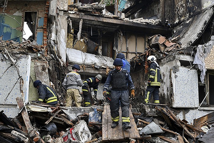 Rescuers work at an apartment building destroyed by Russian shelling Wednesday in Bakhmut in Ukraine’s Donetsk region. More photos at arkansasonline.com/519ukrainemonth3/.
(AP/Andriy Andriyenko)