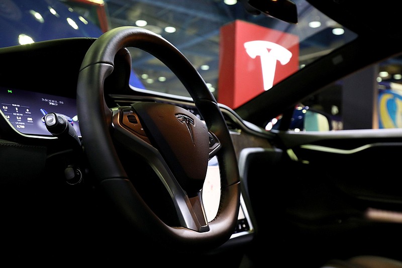 A UK bases security consultant says Tesla Model S cares, like the one seen here in Seoul, South Korea, in 2018, are vulnerable to a hack, allowing a thief to unlock a vehicle, start it and drive away.
(Bloomberg/SeongJoon Cho)