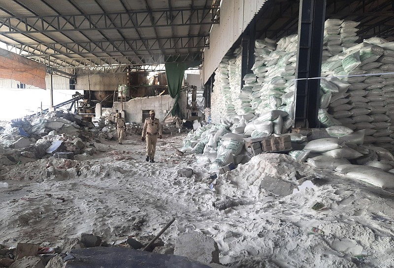 Police inspect a salt packaging factory after its wall collapsed in Morbi district, 135 miles west of Gandhinagar, Gujarat state, India, Wednesday.
(AP)