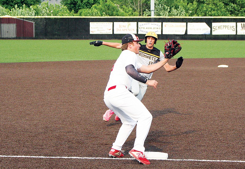 Ryan Newman of Fulton slides into third base as Southern Boone’s Hayden Steelman waits to receive a throw during the Class 4 District 8 Tournament semifinal game in Ashland. (Jeremy Jacob/Fulton Sun)